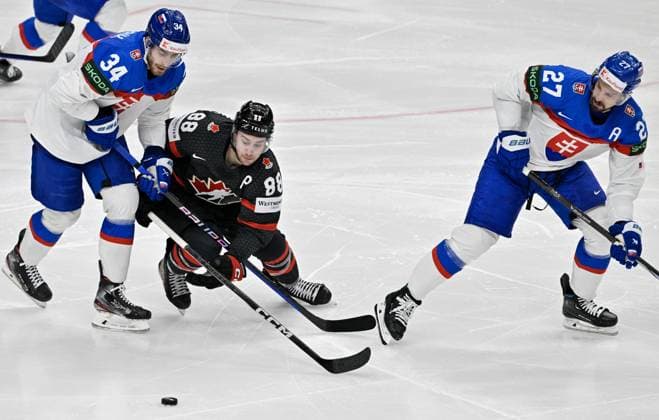 Canada vs Slovakia quarter-final match of the 2024 IIHF World Championship, WM, Weltmeisterschaft in Prague, Czech Republic, on May 23, 2024. L-R Peter Cehlarik (SVK), Andrew Mangiapane (CAN), Marek Hrivik (SVK). (CTKxPhoto VitxSimanek) CTKPhotoP2024052307412  CTKPhotoP2024052307412