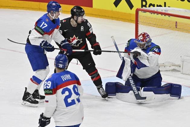 Canada vs Slovakia quarter-final match of the 2024 IIHF World Championship, WM, Weltmeisterschaft in Prague, Czech Republic, on May 23, 2024. L-R Simon Nemec (SVK) Michal Ivan (SVK), Andrew Mangiapane (CAN), goalkeeper Samuel Hlavaj (SVK). (CTKxPhoto VitxSimanek) CTKPhotoP2024052307909  CTKPhotoP2024052307909