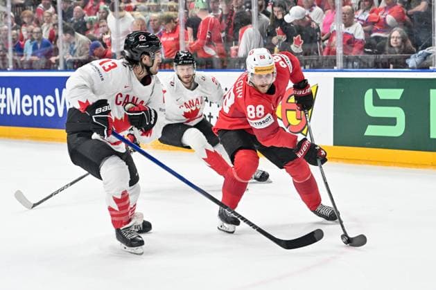 PRAGUE, CZECH REPUBLIC MAY 25 Christoph Bertschy of Switzerland protects the puck from Brandon Tanev of Canada during the 2024 IIHF Ice Hockey World Championship Czechia Semifinal match between Canada and Switzerland at Prague Arena on May 25, 2024 in Prague, Czech Republic Prague Prague Arena Czech Republic Copyright: xJustPictures.ch AndreaxBrancax jp-en-EuSpIm-AB_25052024_AAB_4004
