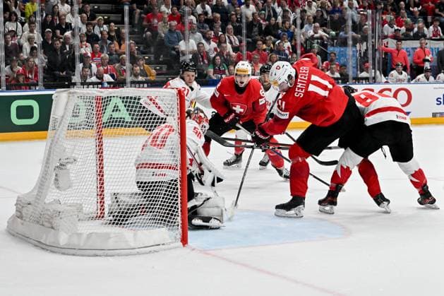 PRAGUE, CZECH REPUBLIC MAY 25 Sven Senteler of Switzerland battle for the puck in front of goalkeeper Jordan Binnington of Canada during the 2024 IIHF Ice Hockey World Championship Czechia Semifinal match between Canada and Switzerland at Prague Arena on May 25, 2024 in Prague Prague, Czech Republic Prague Prague Arena Czech Republic Copyright: xJustPictures.ch AndreaxBrancax jp-en-EuSpIm-AB_25052024_AAB_4376