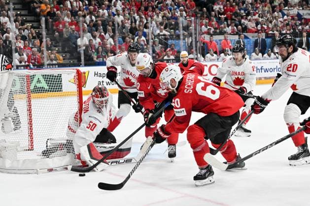 PRAGUE, CZECH REPUBLIC MAY 25 Tristan Scherwey of Switzerland battles for the puck against goalkeeper Jordan Binnington of Canada during the 2024 IIHF Ice Hockey World Championship Czechia Semifinal match between Canada and Switzerland at Prague Arena on May 25, 2024 in Prague Prague, Czech Republic Prague Prague Arena Czech Republic Copyright: xJustPictures.ch AndreaxBrancax jp-en-EuSpIm-AB_25052024_AAB_4409