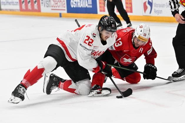 PRAGUE, CZECH REPUBLIC MAY 25 Dylan Cozens of Canada and Nico Hischier of Switzerland in a battle for the puck during the 2024 IIHF Ice Hockey World Championship Czechia Semifinal match between Canada and Switzerland at Prague Arena on May 25, 2024 in Prague Prague, Czech Republic Prague Prague Arena Czech Republic Copyright: xJustPictures.ch AndreaxBrancax jp-en-EuSpIm-AB_25052024_AAB_4447