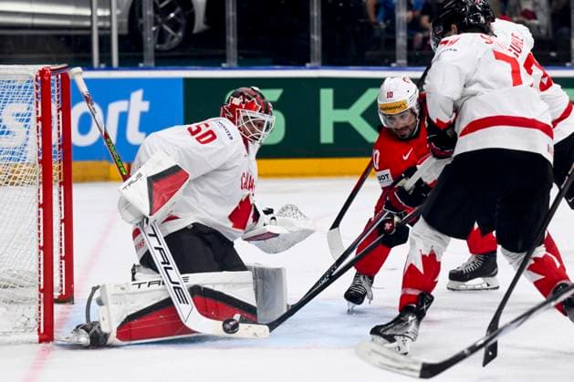 L-R goalkeeper Jordan Binnington (CAN) and Andres Ambuhl (SUI) in action during the 2024 IIHF World Championship, WM, Weltmeisterschaft semi-final match Canada vs Switzerland, in Prague, Czech Republic, on May 25, 2024. (CTKxPhoto OndrejxDeml) CTKPhotoP2024052505820  CTKPhotoP2024052505820
