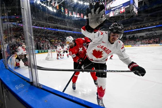 PRAGUE, CZECH REPUBLIC MAY 25 Andres Ambuhl of Switzerland in a battle along the boards with Dylan Cozens of Canada during the 2024 IIHF Ice Hockey World Championship Czechia Semifinal match between Canada and Switzerland at Prague Arena on May 25, 2024 in Prague Prague, Czech Republic Prague Prague Arena Czech Republic Copyright: xJustPictures.ch AndreaxBrancax jp-en-EuSpIm-AB_25052024_DSC_5763