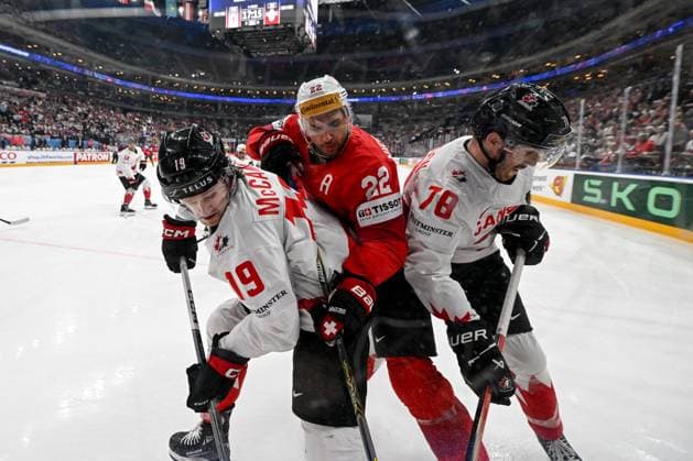 PRAGUE, CZECH REPUBLIC MAY 25 Nino Niederreiter of Switzerland C in a battle along the boards with Jared Mccann of Canada L and Damon Severson of Canada R during the 2024 IIHF Ice Hockey World Championship Czechia Semifinal match between Canada and Switzerland at Prague Arena on May 25, 2024 in Prague, Czech Republic Prague Prague Arena Czech Republic Copyright: xJustPictures.ch AndreaxBrancax jp-en-EuSpIm-AB_25052024_DSC_5823