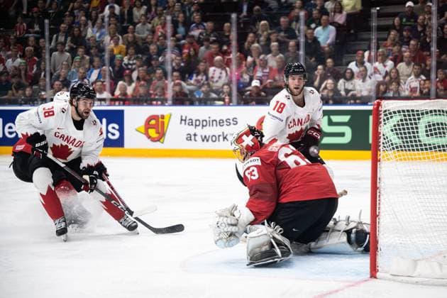 240525 Brandon Hagel and Dawson Mercer of Canada against goaltender Leonardo Genoni of Switzerland during the 2024 IIHF Ice Hockey World Championship semifinal game between Canada and Switzerland on May 25, 2024 in Prague Photo Maxim ThorÃ BILDBYRAN kod MT MT0602 ishockey ice hockey ishockey vm canada switzerland 2024 iihf ice hockey world championship bbeng schweiz kanada semifinal  Copyright: MAXIMxTHORE BB240525MT207