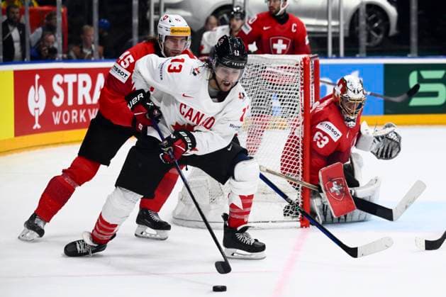 L-R Michael Fora (SUI), Brandon Tanev (CAN) and goalkeeper Leonardo Genoni (SUI) in action during the 2024 IIHF World Championship, WM, Weltmeisterschaft semi-final match Canada vs Switzerland, in Prague, Czech Republic, on May 25, 2024. (CTKxPhoto OndrejxDeml) CTKPhotoP2024052506227  CTKPhotoP2024052506227