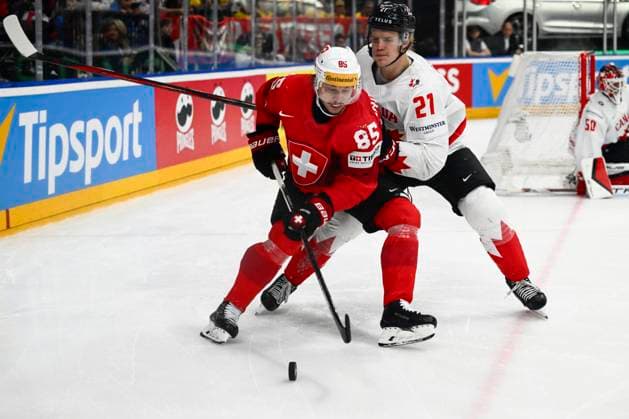 L-R Sven Andrighetto (SUI) and Kaiden Guhlein (CAN) action during the 2024 IIHF World Championship, WM, Weltmeisterschaft semi-final match Canada vs Switzerland, in Prague, Czech Republic, on May 25, 2024. (CTKxPhoto OndrejxDeml) CTKPhotoP2024052507148  CTKPhotoP2024052507148