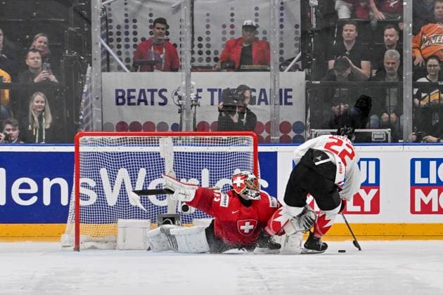 PRAGUE, CZECH REPUBLIC MAY 25 goalkeeper Leonardo Genoni of Switzerland makes a save on Dylan Cozens of Canada during the 2024 IIHF Ice Hockey World Championship Czechia Semifinal match between Canada and Switzerland at Prague Arena on May 25, 2024 in Prague, Czech Republic Prague Prague Arena Czech Republic Copyright: xJustPictures.ch AndreaxBrancax jp-en-EuSpIm-AB_25052024_AAB_6360