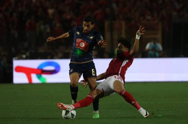 CAIRO, EGYPT - MAY 25: Houssem Tka of ES Tunis and Marwan Attia of Al Ahly in action during the CAF Champions League Final Second Leg match between Al Ahly and Esperance Sportive Tunis at Cairo International Stadium on May 25, 2024 in Cairo, Al Ahly v Esperance Sportive Tunis: Final Second Leg - CAF Champions League Copyright: xPhotoxbyxM.Bayoumy SFSIx