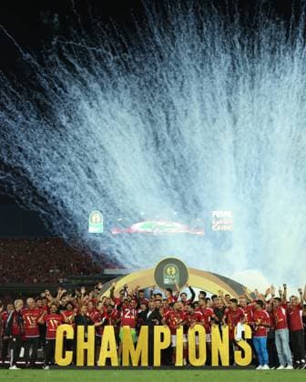 CAIRO, EGYPT - MAY 25: Al Ahly players, staff and head coach Marcel Koller celebrate on stage with a trophy after wining the CAF Champions League Final Second Leg match between Al Ahly and Esperance Sportive Tunis at Cairo International Stadium on May 25, 2024 in Cairo, Al Ahly v Esperance Sportive Tunis: Final Second Leg - CAF Champions League Copyright: xPhotoxbyxM.Bayoumy SFSIx