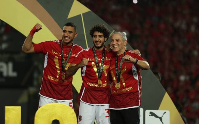 CAIRO, EGYPT - MAY 25: Rami Rabia, Mohamed Hany and head coach Marcel Koller celebrate on stage with a gold medal after wining the CAF Champions League Final Second Leg match between Al Ahly and Esperance Sportive Tunis at Cairo International Stadium on May 25, 2024 in Cairo, Al Ahly v Esperance Sportive Tunis: Final Second Leg - CAF Champions League Copyright: xPhotoxbyxM.Bayoumy SFSIx