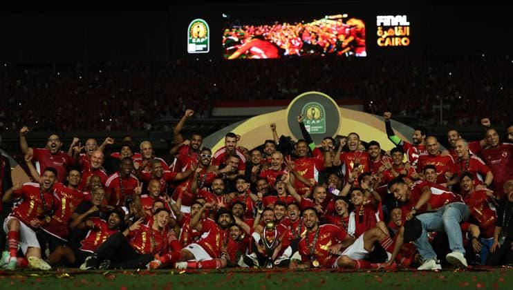 CAIRO, EGYPT - MAY 25: Al Ahly players, staff and head coach Marcel Koller celebrate on stage with a trophy after wining the CAF Champions League Final Second Leg match between Al Ahly and Esperance Sportive Tunis at Cairo International Stadium on May 25, 2024 in Cairo, Al Ahly v Esperance Sportive Tunis: Final Second Leg - CAF Champions League Copyright: xPhotoxbyxM.Bayoumy SFSIx