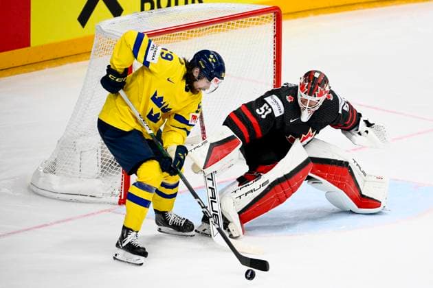L-R Linus Johansson (SWE) and goalkeeper Jordan Binnington (CAN) in action during the 2024 IIHF World Championship, WM, Weltmeisterschaft match for the third place, Sweden vs Canada, in Prague, Czech Republic, on May 26, 2024. (CTKxPhoto OndrejxDeml) CTKPhotoP2024052603758  CTKPhotoP2024052603758
