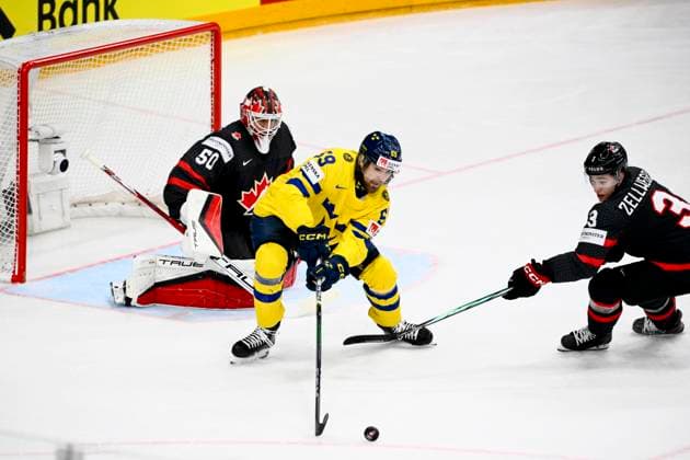 L-R goalkeeper Jordan Binnington (CAN), Linus Johansson (SWE) and Olen Zellweger (CAN) in action during the 2024 IIHF World Championship, WM, Weltmeisterschaft match for the third place, Sweden vs Canada, in Prague, Czech Republic, on May 26, 2024. (CTKxPhoto OndrejxDeml) CTKPhotoP2024052603773  CTKPhotoP2024052603773