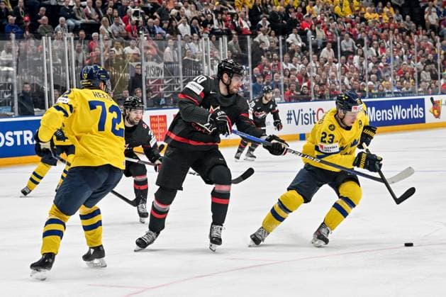 PRAGUE, CZECH REPUBLIC MAY 26 Pierre Luc Dubois of Canada fights for the puck possession with Lucas Raymond of Sweden R during 2024 IIHF Ice Hockey World Championship Czechia Third Place Match between Sweden and Canada at Prague Arena on May 26, 2024 in Prague, Czech Republic Prague Prague Arena Czech Republic Copyright: xJustPictures.ch AndreaxBrancax jp-en-EuSpIm-AB_26052024_AAB_6789