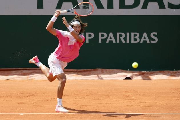 (240526) -- PARIS, May 26, 2024 -- Zhang Zhizhen of China hits a return during the men s singles first round match between Zhang Zhizhen of China and Aleksandar Vukic of Australia at the French Open tennis tournament at Roland Garros, Paris, France, May 26, 2024. ) (SP)FRANCE-PARIS-TENNIS-FRENCH OPEN-MEN S SINGLES MengxDingbo 
