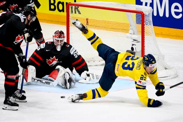 L-R goalkeeper Jordan Binnington (CAN) and Lucas Raymond (SWE) in action during the 2024 IIHF World Championship, WM, Weltmeisterschaft match for the third place, Sweden vs Canada, in Prague, Czech Republic, on May 26, 2024. (CTKxPhoto OndrejxDeml) CTKPhotoP2024052604171  CTKPhotoP2024052604171