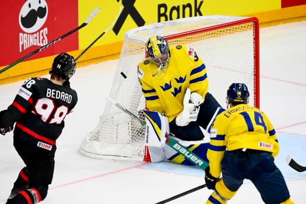 L-R Connor Bedard (CAN), goalkeeper Filip Gustavsson (SWE) and Joel Eriksson Ek (SWE) in action during the 2024 IIHF World Championship, WM, Weltmeisterschaft match for the third place, Sweden vs Canada, in Prague, Czech Republic, on May 26, 2024. (CTKxPhoto OndrejxDeml) CTKPhotoP2024052604282  CTKPhotoP2024052604282