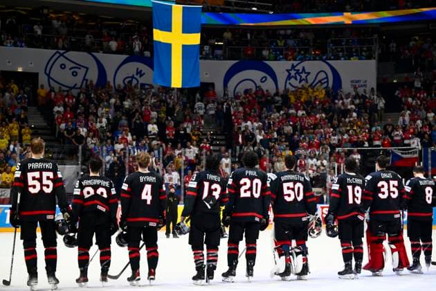 Disappointed players of Canada look at the Swedish flag, after the 2024 IIHF World Championship, WM, Weltmeisterschaft match for the third place, Sweden vs Canada, in Prague, Czech Republic, on May 26, 2024. Players of Sweden won bronze. (CTKxPhoto OndrejxDeml) CTKPhotoP2024052605066  CTKPhotoP2024052605066