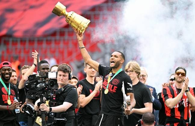 Football, , Germany, Men, Season 2023 2024, Coming Home, BayArena Leverkusen, Bayer Leverkusen celebrates the double Jonathan Tah LEV with the championship trophy and the DFB Cup Jubilation, joy, action DFB DFL REGULATIONS PROHIBIT ANY USE OF PHOTOGRAPHS AS IMAGE SEQUENCES AND OR QUASI VIDEO