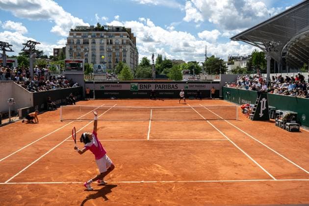 (240527) -- BEIJING, May 27, 2024 -- Zhang Zhizhen (Front) of China serves during the men s singles first round match between Zhang Zhizhen of China and Aleksandar Vukic of Australia at the French Open tennis tournament at Roland Garros, Paris, France, May 26, 2024. ) XINHUA PHOTOS OF THE DAY MengxDingbo 