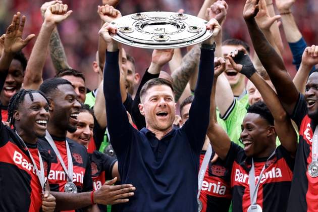 ALONSO Xabi Trainer Team Bayer 04 Leverkusen bei der Siegerehrung mit der Meisterschale DFL Bundesliga Saison 2023 - 2024 Meisterfeier Bundesliga Spiel Bayer 04 Leverkusen - FC Augsburg am 18.05. 2024 in Leverkusen DFL REGULATIONS PROHIBIT ANY USE OF PHOTOGRAPHS as IMAGE SEQUENCES and or QUASI-VIDEO *** ALONSO Xabi Trainer Team Bayer 04 Leverkusen at the award ceremony with the championship trophy DFL Bundesliga season 2023 2024 Championship celebration Bundesliga match Bayer 04 Leverkusen FC Augsburg on 18 05 2024 in Leverkusen DFL REGULATIONS PROHIBIT ANY USE OF PHOTOGRAPHS as IMAGE SEQUENCES and or QUASI VIDEO Copyright: xLacixPerenyix