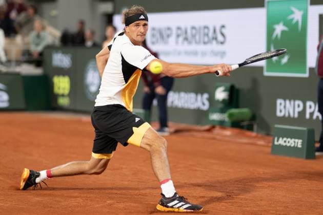 (240527) -- PARIS, May 27, 2024 -- Alexander Zverev of Germany hits a return to Rafael Nadal of Spain during the men s singles 1st round match at the French Open tennis tournament at Roland Garros, Paris, France, May 27, 2024. ) (SP)FRANCE-PARIS-TENNIS-FRENCH OPEN-MEN S SINGLES MengxDingbo 