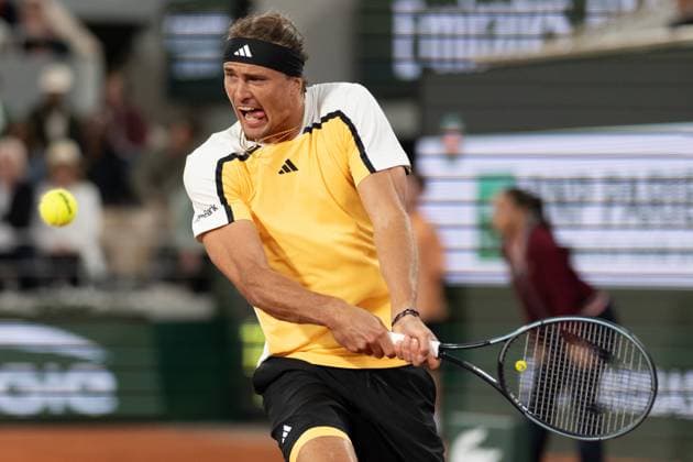 (240527) -- PARIS, May 27, 2024 -- Alexander Zverev of Germany hits a return to Rafael Nadal of Spain during the men s singles 1st round match at the French Open tennis tournament at Roland Garros, Paris, France, May 27, 2024. ) (SP)FRANCE-PARIS-TENNIS-FRENCH OPEN-MEN S SINGLES MengxDingbo 