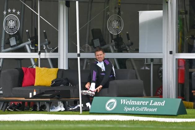 National coach Julian NAGELSMANN GER puts on his football boots Training at the Golf Resort Weimarer Land,training ground German national football team,football training camp in Blankenhain Thuringia on 27 05 2024,