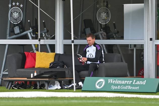 National coach Julian NAGELSMANN GER puts on his football boots Training at the Golf Resort Weimarer Land,training ground German national football team,football training camp in Blankenhain Thuringia on 27 05 2024,