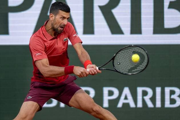 (240529) -- PARIS, May 29, 2024 -- Novak Djokovic hits a return during the men s singles first round match between Novak Djokovic of Serbia and Pierre-Hugues Herbert of France at the French tennis tournament at Roland Garros in Paris, France, on May 28, 2024. ) (SP)FRANCE-PARIS-TENNIS-FRENCH OPEN-MEN S SINGLES MengxDingbo 