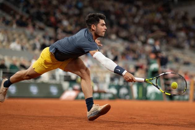 (240530) -- PARIS, May 30, 2024 -- Carlos Alcaraz hits a return during the men s singles second round match between Carlos Alcaraz of Spain and Jesper de Jong of the Netherlands at the French Open tennis tournament at Roland Garros, Paris, France, May 29, 2024. ) (SP)FRANCE-PARIS-TENNIS-FRENCH OPEN-MEN S SINGLES MengxDingbo 
