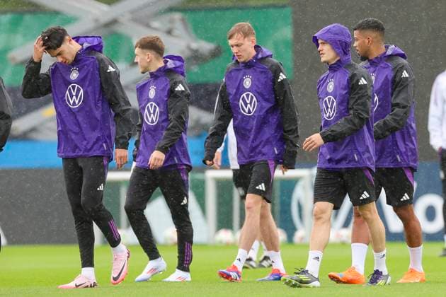 Aleksandar Pavlovic, Brajan Gruda, Maximilian Beier, Florian Wirtz and Benjamin Henrichs run across the training pitch in the rain, training day 4, training camp of the German national team, Spa and GolfResort Weimarer Land, 30 05 2024, Blankenhain, Germany
