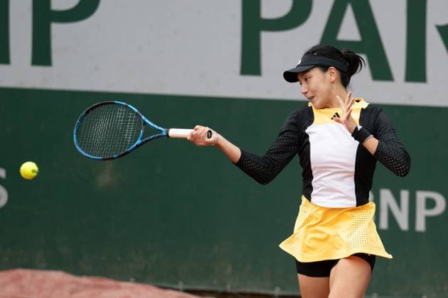 (240530) -- PARIS, May 30, 2024 -- Wang Xinyu of China hits a return during the women s singles second round match against Viktoriya Tomova of Bulgaria at the French Open tennis tournament at Roland Garros in Paris, France, May 30, 2024. ) (SP)FRANCE-PARIS-TENNIS-FRENCH OPEN-WOMEN S SINGLES MengxDingbo 