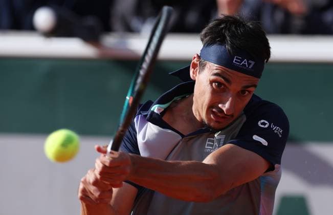 (240531) -- PARIS, May 31, 2024 -- Lorenzo Sonego of Italy hits a return during the men s singles second round match between Zhang Zhizhen of China and Lorenzo Sonego of Italy at the French Open tennis tournament at Roland Garros, Paris, France, May 30, 2024. ) (SP)FRANCE-PARIS-TENNIS-FRENCH OPEN-MEN S SINGLES GaoxJing 