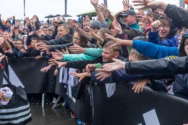 Report 31 05 2024 Arrival party of the German mens national team at adidas in Herzogenaurach in pouring rain At the front of the barrier the young fans ask for a jersey Herzogenaurach Bavaria Germany