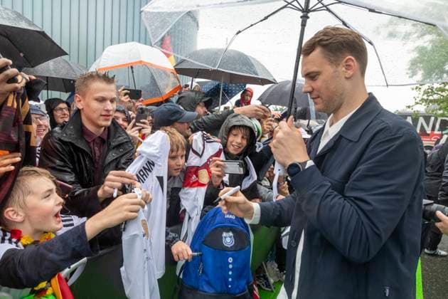 Report 31 05 2024 Arrival party of the German mens national team at adidas in Herzogenaurach in pouring rain Manuel Neuer with autograph collectors Herzogenaurach Bavaria Germany