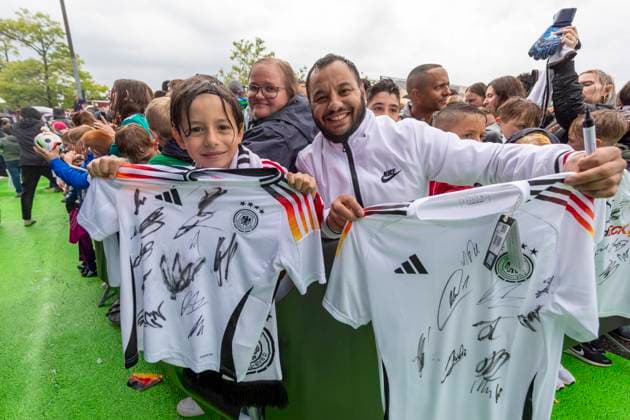 Report 31 05 2024 Arrival party of the German mens national team at adidas in Herzogenaurach in pouring rain Little Muaremou and his father waited 11 hours in this place, the yield is impressive Herzogenaurach Bavaria Germany