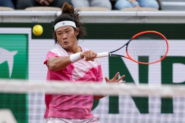 (240601) -- PARIS, June 1, 2024 -- Zhang Zhizhen of China hits a return during the men s singles third round match between Zhang Zhizhen of China and Stefanos Tsitsipas of Greece at the French Open tennis tournament at Roland Garros, Paris, France, May 31, 2024. ) (SP)FRANCE-PARIS-TENNIS-FRENCH OPEN-MEN S SINGLES MengxDingbo 