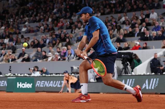 (240601) -- PARIS, June 1, 2024 -- Pavel Kotov hits a return during the men s singles third round match between Jannik Sinner of Italy and Pavel Kotov of Russia at the French Open tennis tournament at Roland Garros, Paris, France, May 31, 2024. ) (SP)FRANCE-PARIS-TENNIS-FRENCH OPEN-MEN S SINGLES GaoxJing 