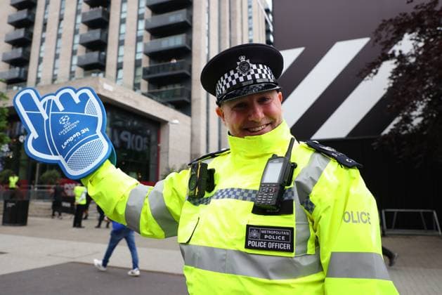1st June 2024; Wembley Stadium, London, England; UEFA Champions League Football Final, Borussia Dortmund versus Real Madrid; Metropolitan Police officer comedically giving directions to Borussia Dortmund and Real Madrid fans with a UEFA Champions League Football Final foam hand  ActionPlus12649547 JohnxPatrickxFletcher