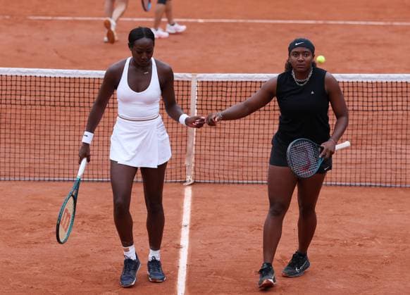 (240601) -- PARIS, June 1, 2024 -- Alycia Parks (L) fists with Hailey Baptiste of the United States during the women s doubles first round match between Wang Xinyu of China Shibahara Ena of Japan and Alycia Parks Hailey Baptiste of the United States at the French tennis tournament in Paris, France, June 1, 2024. ) (SP)FRANCE-PARIS-TENNIS-FRENCH OPEN-WOMEN S DOUBLES GaoxJing 