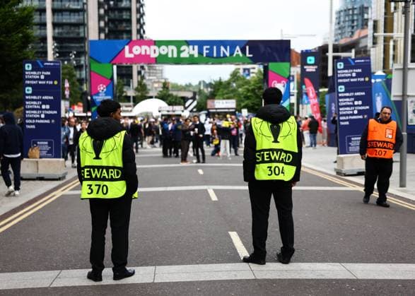 London, England, 1st June 2024. Stewards line the road leading up to the stadium during the UEFA Champions League final match at Wembley Stadium, London. Picture credit should read: David Klein Sportimage EDITORIAL USE ONLY. No use with unauthorised audio, video, data, fixture lists, club league logos or live services. Online in-match use limited to 120 images, no video emulation. No use in betting, games or single club league player publications. SPI-3169-0005