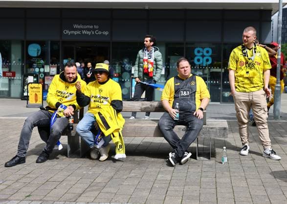 London, England, 1st June 2024. Borussia Dortmund fans and a lone Real Madrid fan on the Wembley way before the UEFA Champions League final match at Wembley Stadium, London. Picture credit should read: David Klein Sportimage EDITORIAL USE ONLY. No use with unauthorised audio, video, data, fixture lists, club league logos or live services. Online in-match use limited to 120 images, no video emulation. No use in betting, games or single club league player publications. SPI-3169-0008