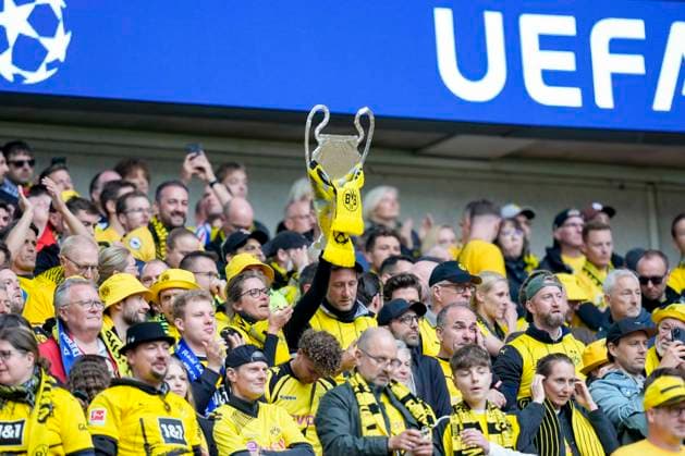 A Dortmund fan holds up the Champions League trophy before the game, UEFA Champions League 2023 24 - Final, Borussia Dortmund vs Real Madrid CF, Wembley Stadium, June 1, 2024, London, United Kingdom.