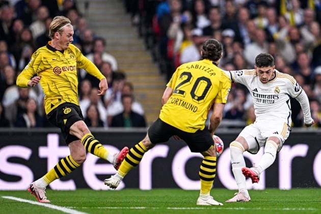 2024-06-01 Borussia Dortmund v Real Madrid CF - UEFA Champions League Final 2023 24 LONDON, UNITED KINGDOM - JUNE 1: Federico Valverde of Real Madrid CF takes a shot while Julian Brandt of Borussia Dortmund and Marcel Sabitzer of Borussia Dortmund try to stop him during the UEFA Champions League Final 2023 24 match between Borussia Dortmund and Real Madrid CF at Wembley Stadium on June 1, 2024 in London, United Kingdom. (Photo by Pablo Morano BSR Agency) London United Kingdom Content not available for redistribution in The Netherlands directly or indirectly through any third parties. Copyright: xBSRxAgencyx
