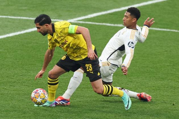 Emre Can of Borussia Dortmund is challenged by Jude Bellingham of Real Madrid Borussia Dortmund v Real Madrid, UEFA Champions League, Final, Football, Wembley Stadium, London, UK - 01 June 2024 EDITORIAL USE ONLY No use with unauthorised audio, video, data, fixture lists, club league logos or live services. Online in-match use limited to 120 images, no video emulation. No use in betting, games or single club league player publications. Copyright: xPaulxCurrie Shutterstockx 14516316ay