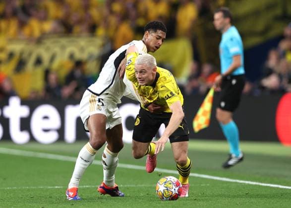 London, England, 1st June 2024. Julian Ryerson of Borussia Dortmund gets past Jude Bellingham of Real Madrid during the UEFA Champions League final match at Wembley Stadium, London. Picture credit should read: David Klein Sportimage EDITORIAL USE ONLY. No use with unauthorised audio, video, data, fixture lists, club league logos or live services. Online in-match use limited to 120 images, no video emulation. No use in betting, games or single club league player publications. SPI-3169-0096