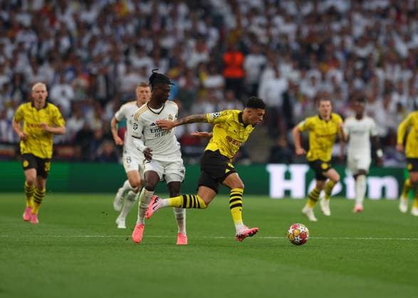 1st June 2024; Wembley Stadium, London, England; UEFA Champions League Football Final, Borussia Dortmund versus Real Madrid; Eduardo Camavinga of Real Madrid challenges Jadon Sancho of Borussia Dortmund  ActionPlus12649833 JohnxPatrickxFletcher